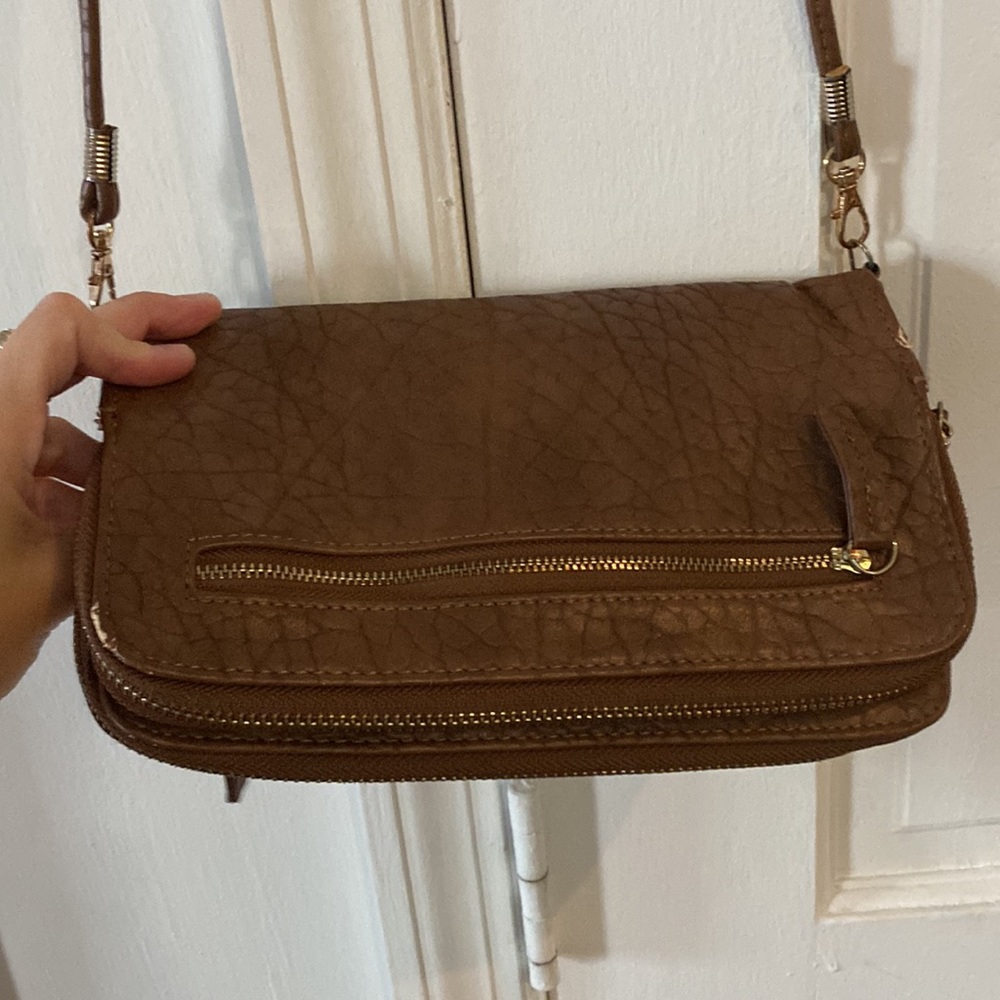 Brown leather purse with many compartments